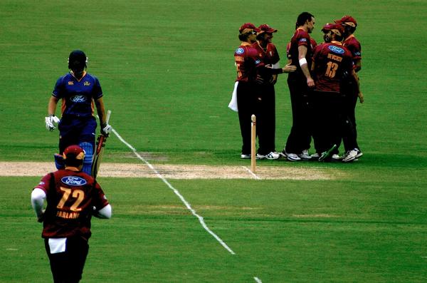 Knights team-mates congratulate Graeme Aldridge on taking the wicket of Otago's Neil Broom to become the New Zealand record-holder for one-day domestic bowling